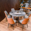 Bộ Bàn Ăn Tròn Mặt Đá Xoay 6 Ghế Phối Cam Xám – Thiết Kế Độc Đáo, Tiện Lợi